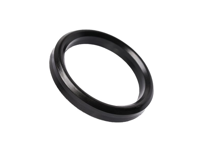A WSP Extreme® Bronze well service packing ring shown at an angle, showing the fabric-reinforced sealing face.